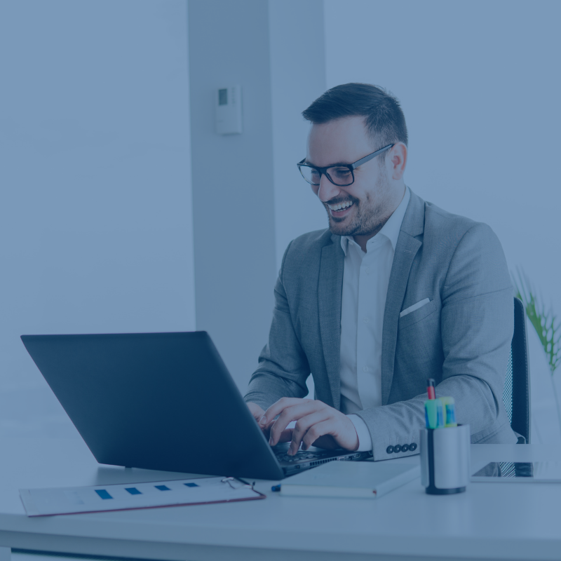 Insurance Image of a man on a laptop.